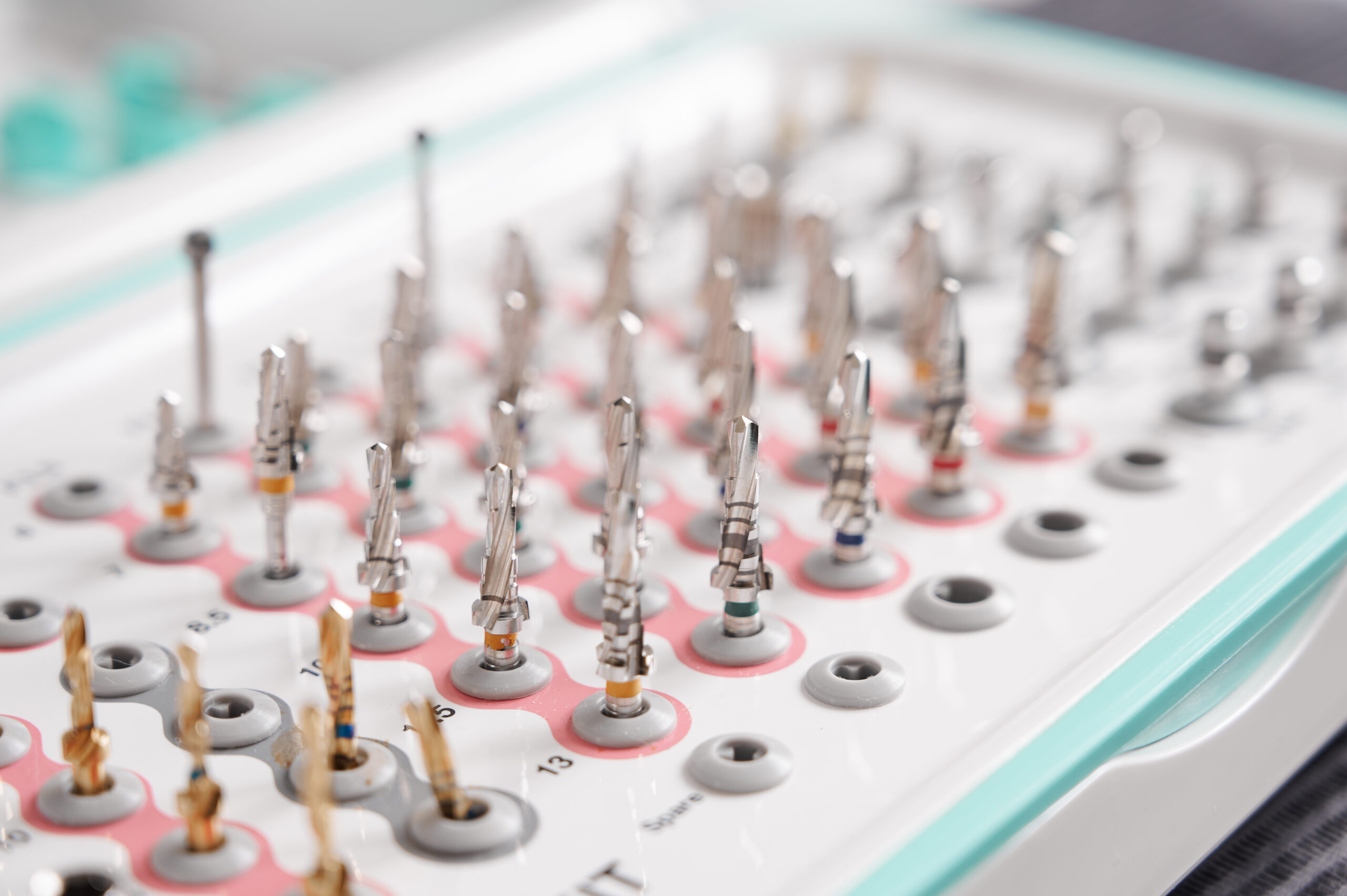 Surgical taper kit Set of drill nozzles for a dental bur machine for implants. Surgical taper kit. Macro, close up. Concept of contemporary dental technologies
